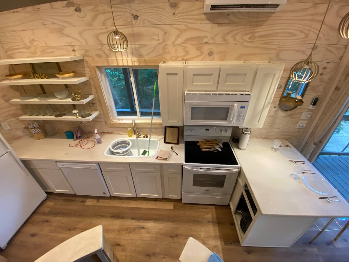 Full kitchen with white cabinets